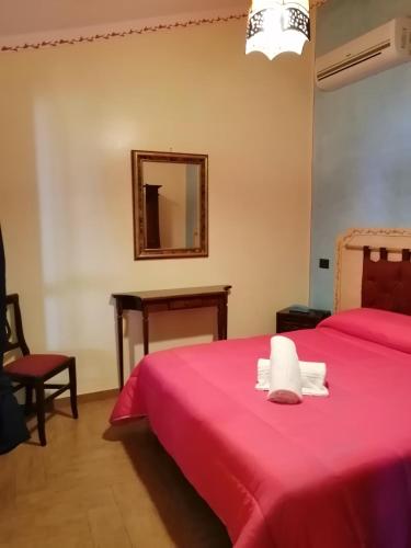 Cama o camas de una habitación en B&B Donna Sabella