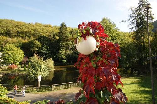 a sculpture of a flower in a park at Bertricher Hof Hotel Garni in Bad Bertrich