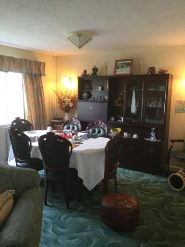 a dining room with a table and chairs at Bunillidh in Drumnadrochit