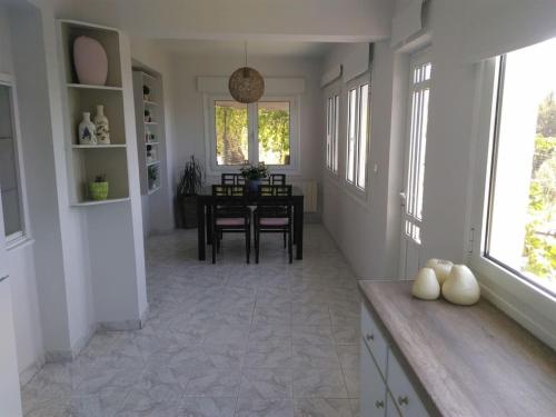 Gambar di galeri bagi House with fruit trees, olive trees, and sea view. di Vathý