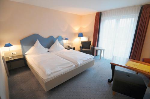 Кровать или кровати в номере Haus am Meer Steinhude