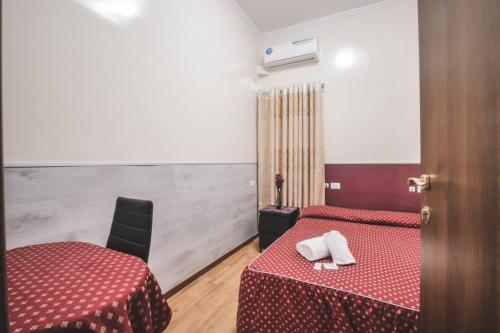 Postel nebo postele na pokoji v ubytování Vertex Guest House