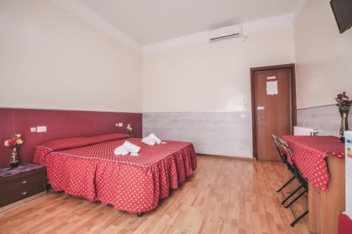 Postel nebo postele na pokoji v ubytování Vertex Guest House