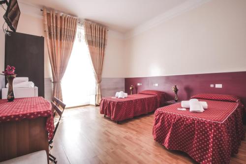 Postel nebo postele na pokoji v ubytování Vertex Guest House