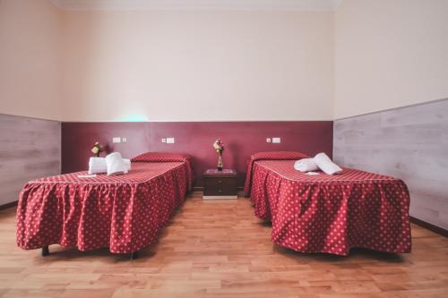 Postel nebo postele na pokoji v ubytování Vertex Guest House