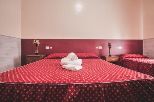 Postel nebo postele na pokoji v ubytování Vertex Guest House