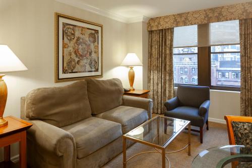 a living room with a couch and a chair at The Manhattan Club in New York