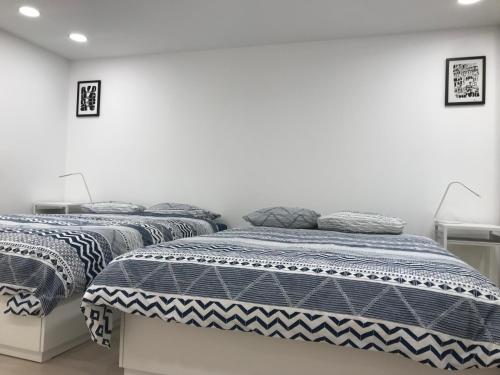 Posteľ alebo postele v izbe v ubytovaní Blaha Art Apartment