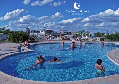 a group of people in a swimming pool at SUEÑOS DE TERMAS in Chajarí