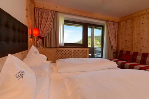 Postel nebo postele na pokoji v ubytování Hotel Alaska