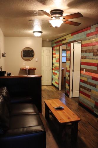 a living room with a couch and a table at Lone Fir Resort in Cougar