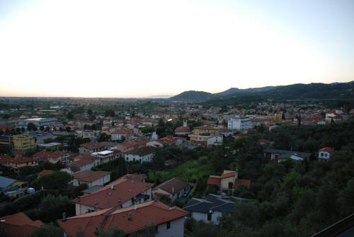 an aerial view of a town with houses at La Chandelle in Massarosa