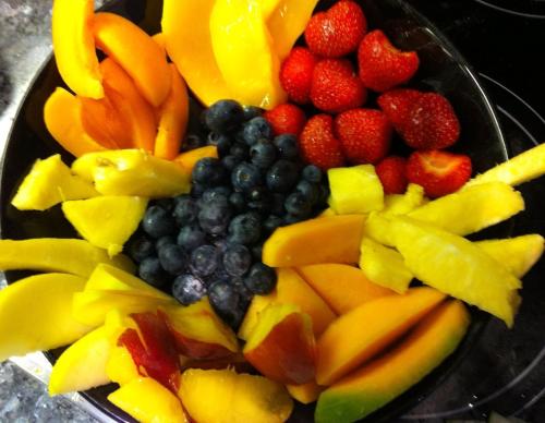 a bowl filled with fruits and vegetables on a table at Haus Tirolerland in Oetz