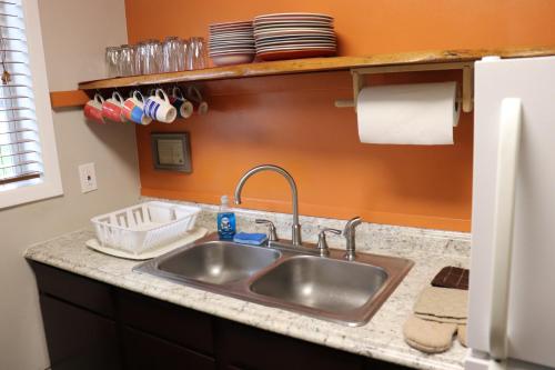 a kitchen with a sink and a counter top at Lone Fir Resort in Cougar