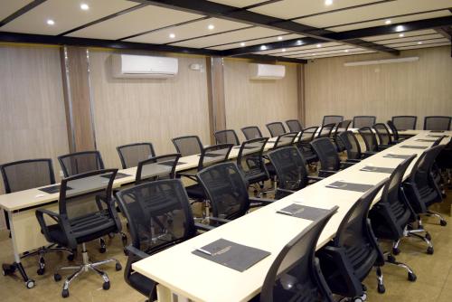 a large room with rows of tables and chairs at Gran Mundo Hotel & Suites in Lima