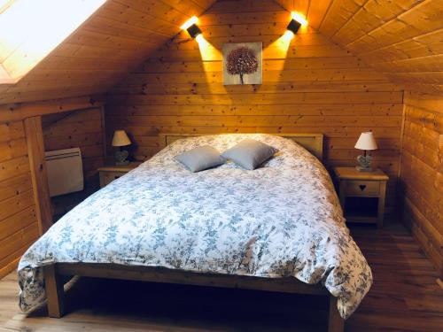 Кровать или кровати в номере Le Hygge Chalet Gérardmer-Spa