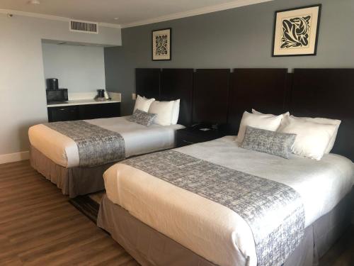 a hotel room with two beds in a room at Best Western Plus Dana Point Inn-by-the-Sea in Dana Point