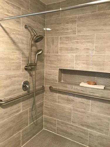 a shower with a shower head in a bathroom at Desert Inn in Mojave