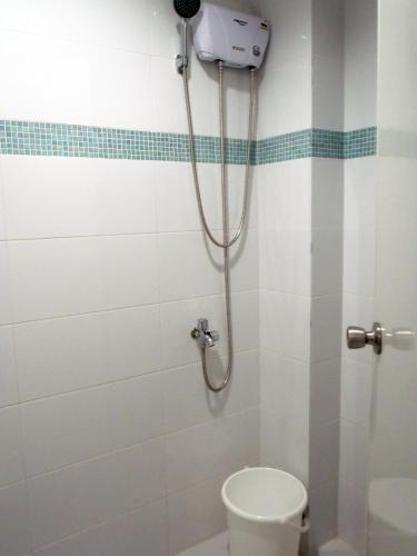 a shower stall with a toilet in a bathroom at Seascape Beach Resort Oslob in Oslob
