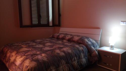 Postel nebo postele na pokoji v ubytování Chalet Reventino