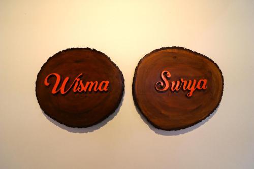 two chocolate cakes with the words virma and swiya on them at Wisma Surya in Pangkalanuringin