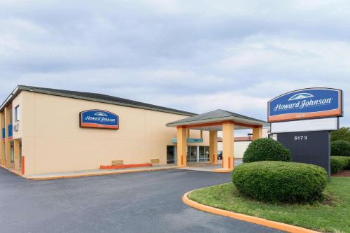 a front view of a library with a sign on it at Howard Johnson by Wyndham Virginia Beach in Virginia Beach