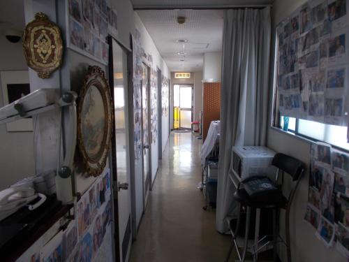 a hallway of a room with a mirror on the wall at Hotel Avanti in Tokushima