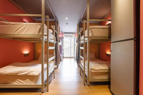 a room with four bunk beds in a dorm room at Siamaze Hostel in Bangkok