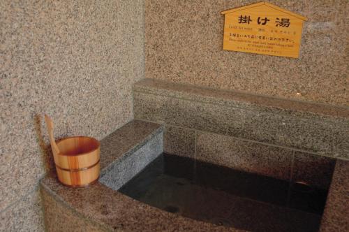 a bucket sitting on the corner of a building at Hotel Futaba in Yuzawa