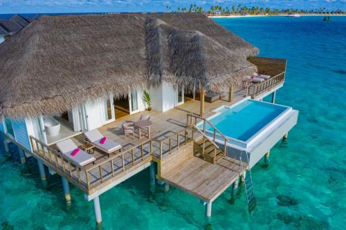a overwater villa in the water with a pool at Sun Siyam Iru Veli - 24 Hours Premium All-Inclusive with Free Transfers in Dhaalu Atoll