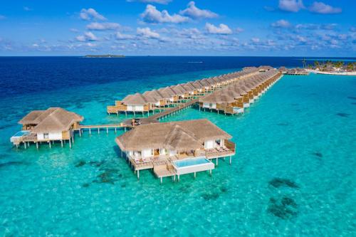 an aerial view of a resort in the ocean at Sun Siyam Iru Veli - 24 Hours Premium All-Inclusive with Free Transfers in Dhaalu Atoll