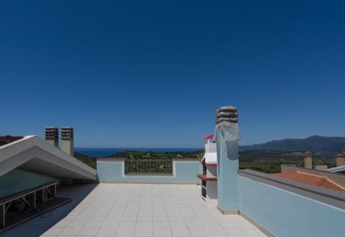 a view from the balcony of a house with a blue sky at Appartamento Belvedere Sassos P 3267 in Tresnuraghes