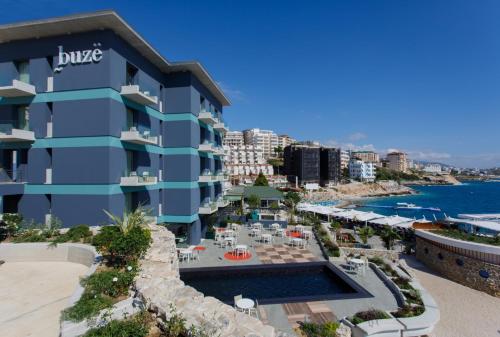 a view of the hotel from the beach at Buzë Boutique Hotel in Sarandë