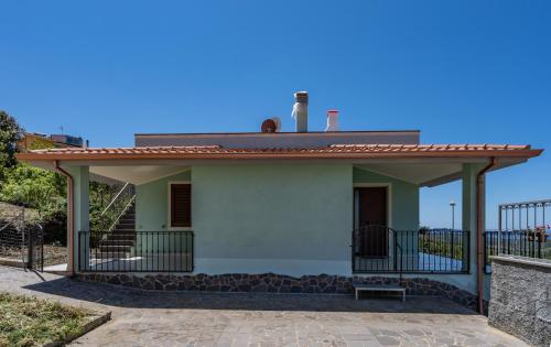 a small white house with a roof at Appartamento Belvedere Sassos P 3267 in Tresnuraghes