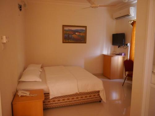 Postel nebo postele na pokoji v ubytování Plaza Hotel