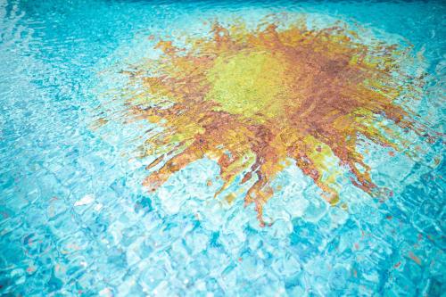 a painting of a hand in the water at Hotel Kennedy in Lido di Jesolo