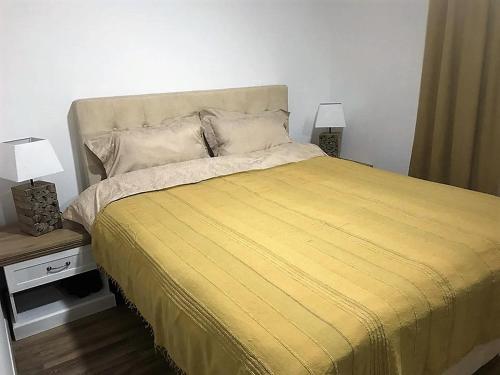Postel nebo postele na pokoji v ubytování Eko Apartmani Krackovic