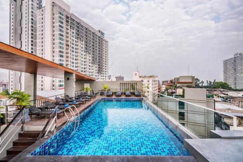 a swimming pool on the roof of a building at 247 Boutique Hotel in Pattaya Central