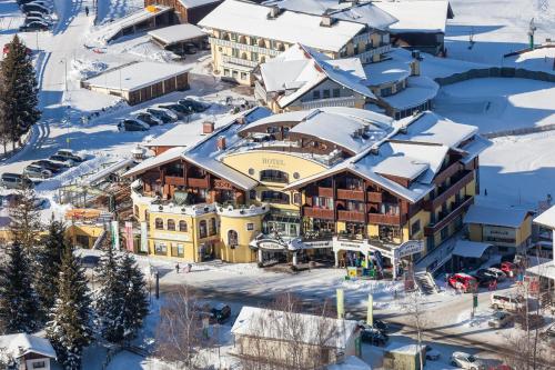 an aerial view of a resort in the snow at Hotel Erlebniswelt Stocker in Schladming