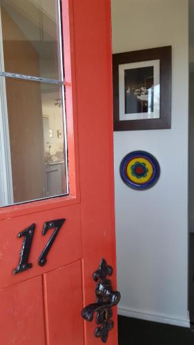 a red door with the number on it at The Apartment Bushmills in Bushmills