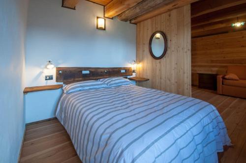 Een bed of bedden in een kamer bij La Cascina d'Orleans