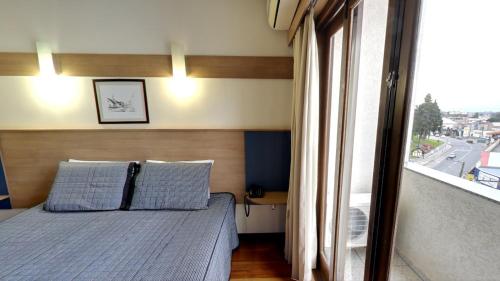 Llit o llits en una habitació de Hotel Urupes