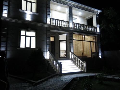 a house at night with the front door lit up at Viva hotel Gabala with outdoor pool ,Sauna and Waterfall in Gabala