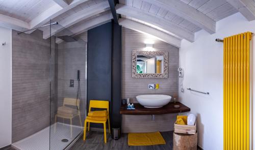 a bathroom with a sink and a glass shower at 150 LatoMare in Marina di Carrara