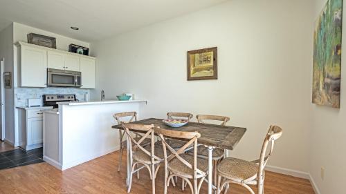 a kitchen with a wooden table and chairs in a room at The Hermitage at Napeague in Amagansett