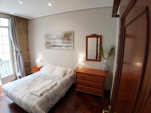 A bed or beds in a room at Apartamento Pórtico Paraíso