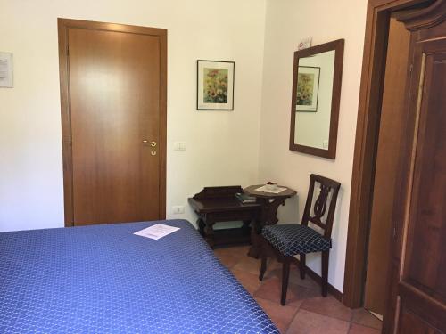 En eller flere senger på et rom på Belvedere Hotel & Villa