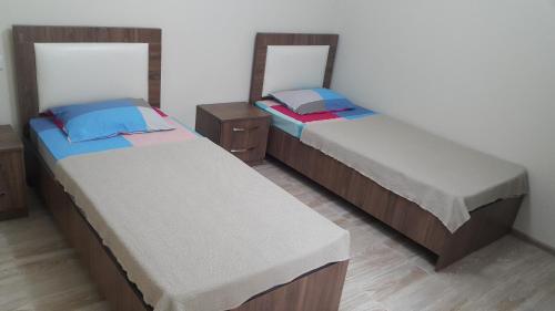 Llit o llits en una habitació de Deme House