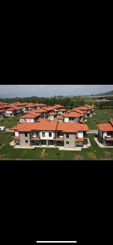 a large group of houses with red roofs at Pravets Resort Apartments in Pravets