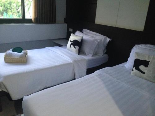 Postel nebo postele na pokoji v ubytování Bed By City Hotel